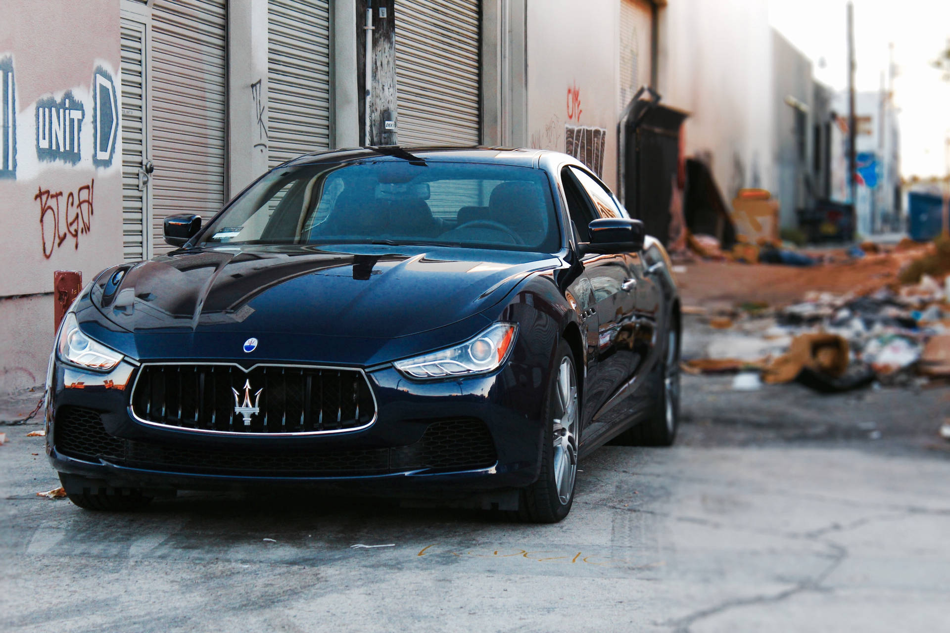 Maserati Car On Alleyway Background