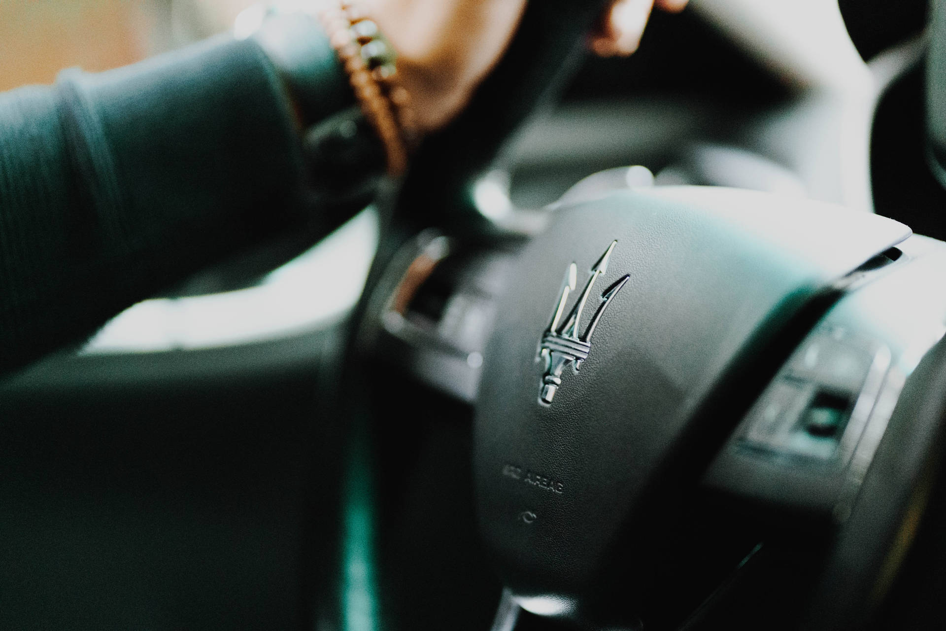 Maserati Steering Wheel Close-up Background