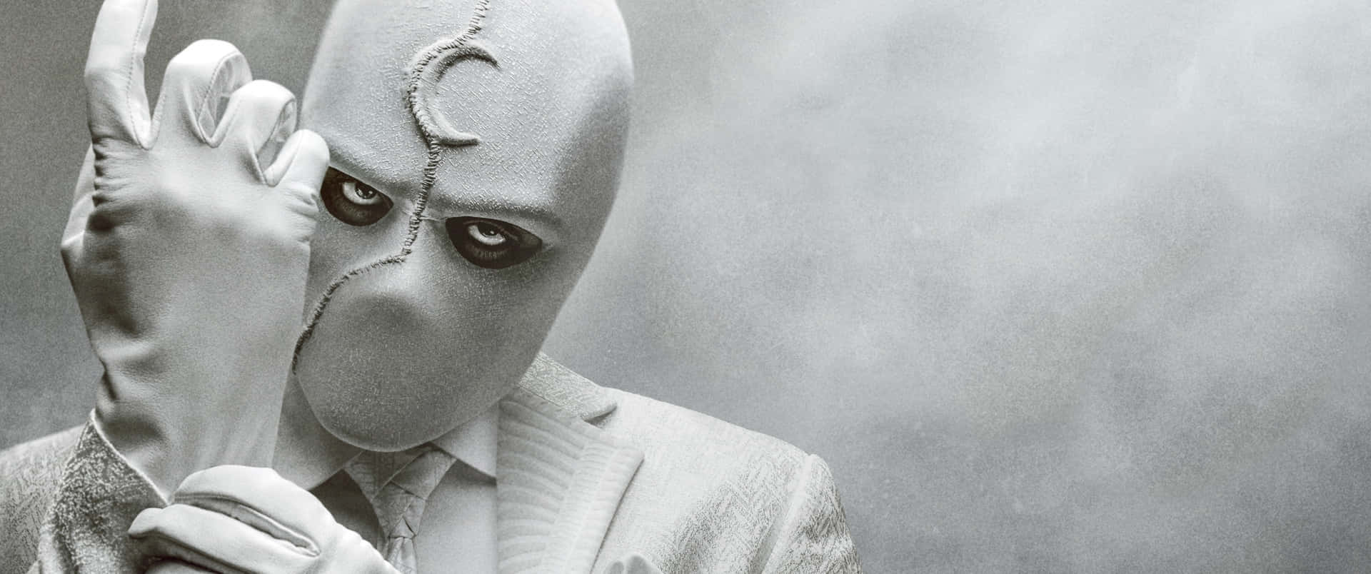 Masked_ Figure_ Gesturing_ Silence Background