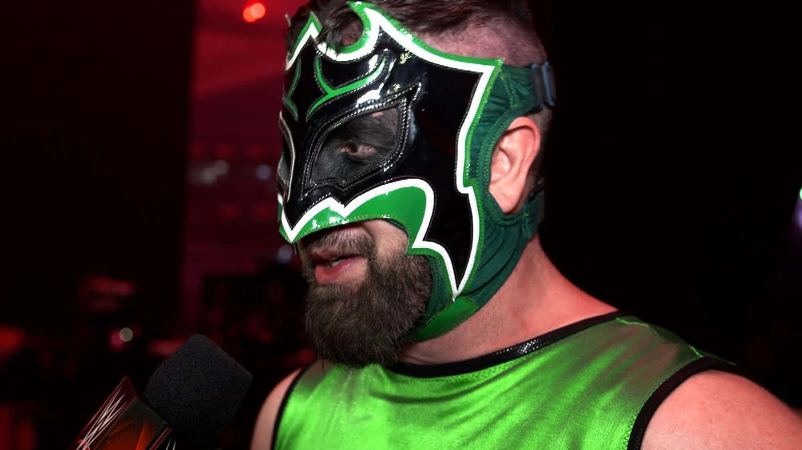 Masked Wrestler Green Attire Background
