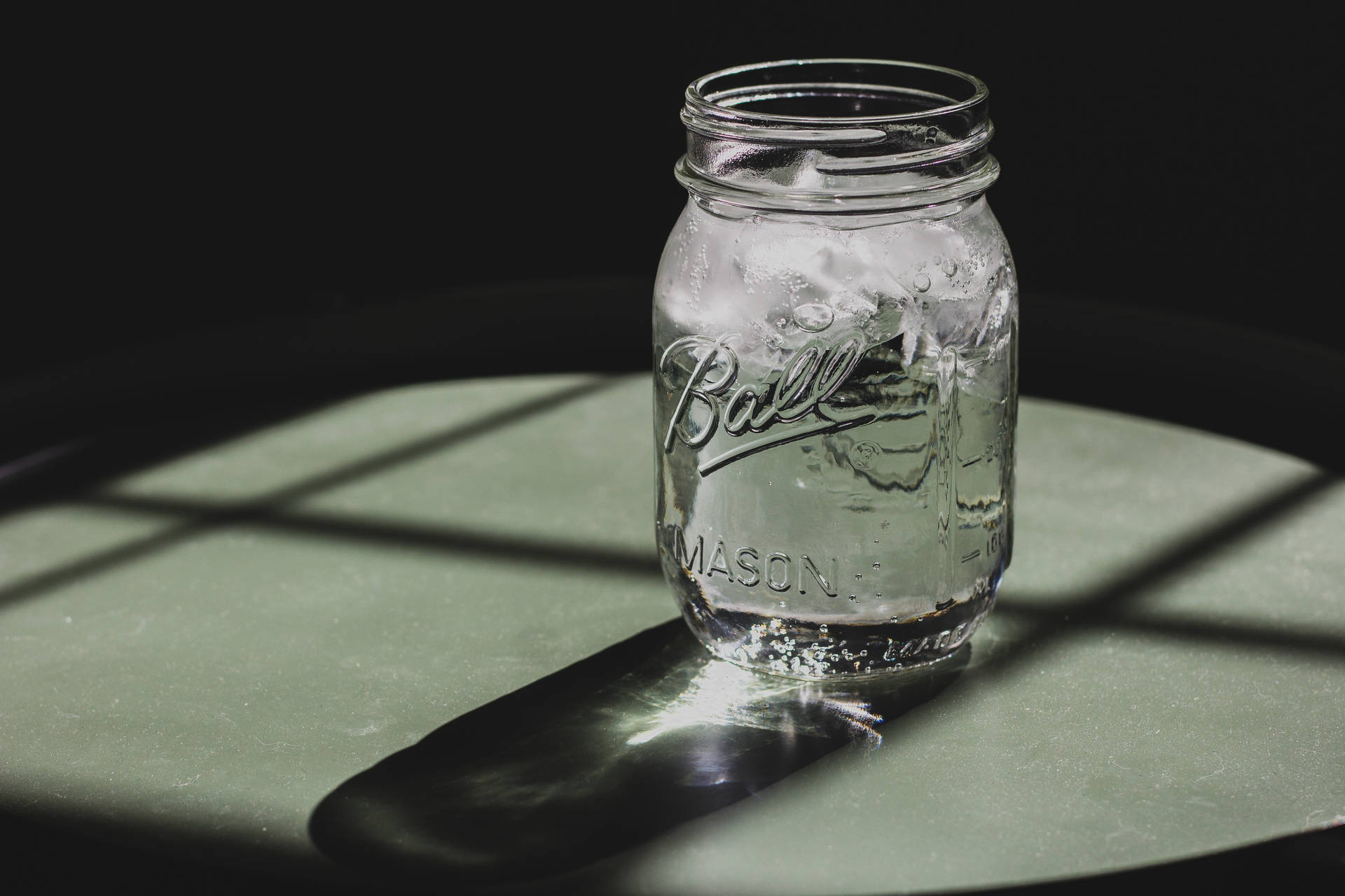 Mason Jar And Iced Water Background