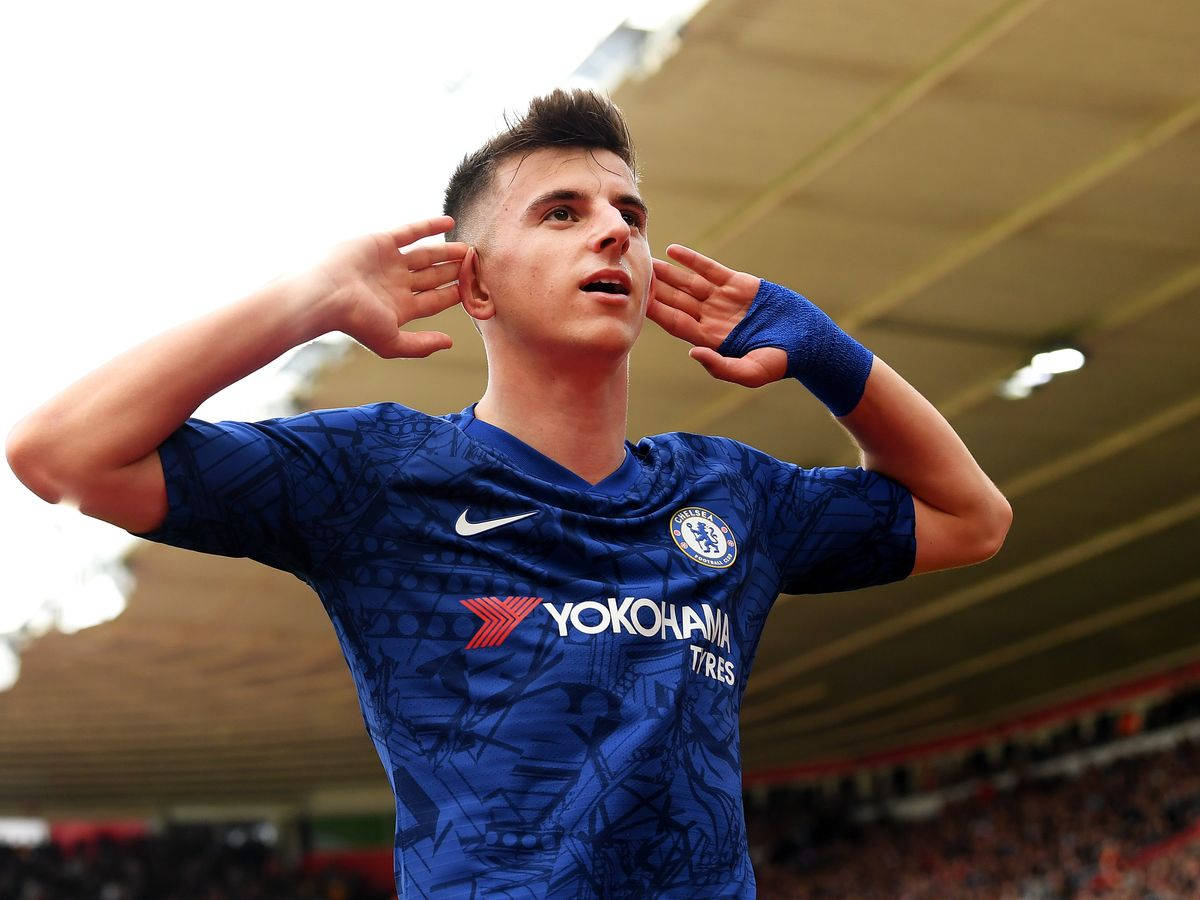 Mason Mount Hands Cupping Ears Background