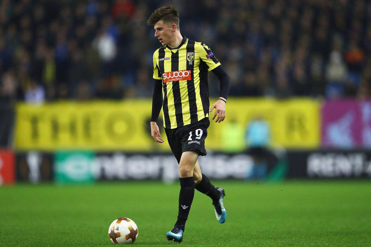 Mason Mount Wearing Black And Yellow Background