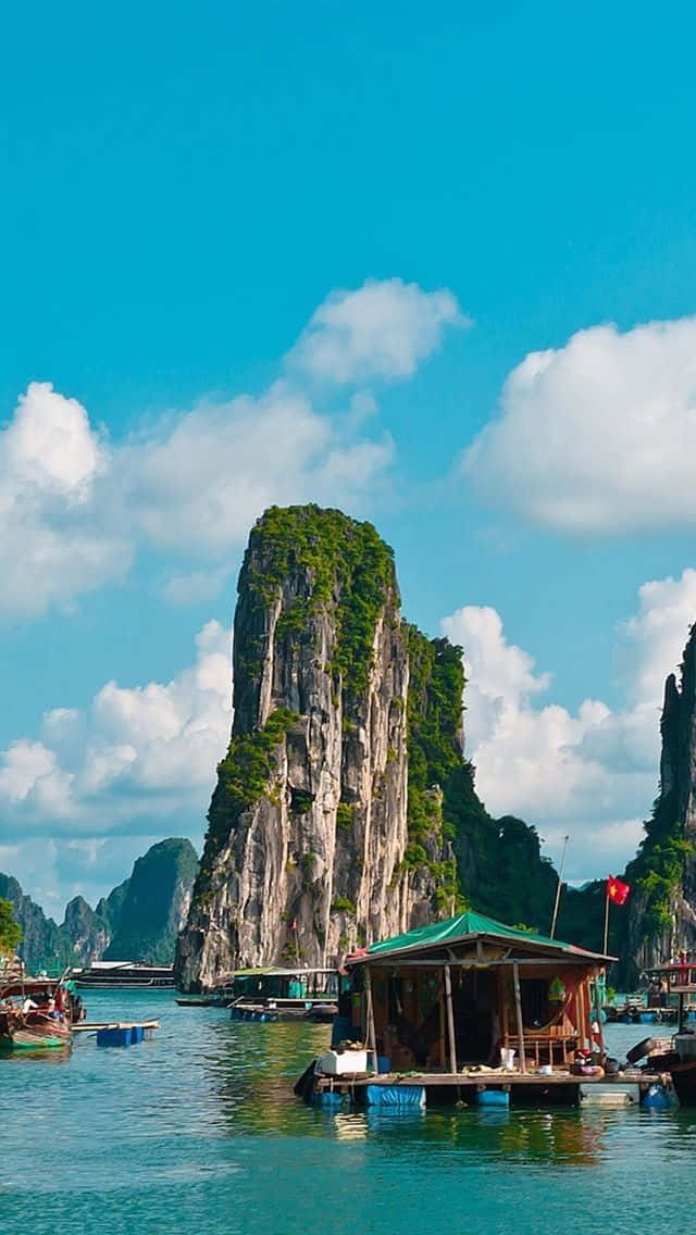 Massive Rock Formations In Halong Bay Background