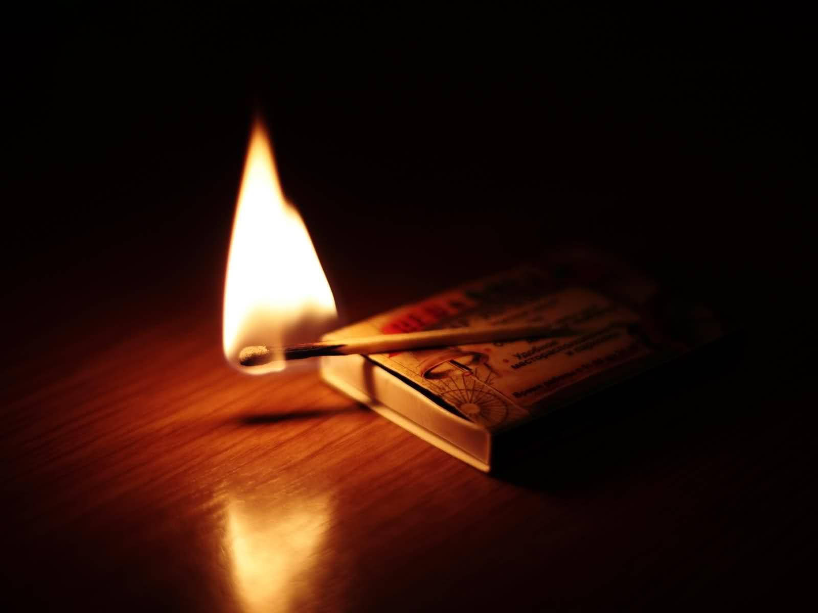 Match Burned On Matchbox Background