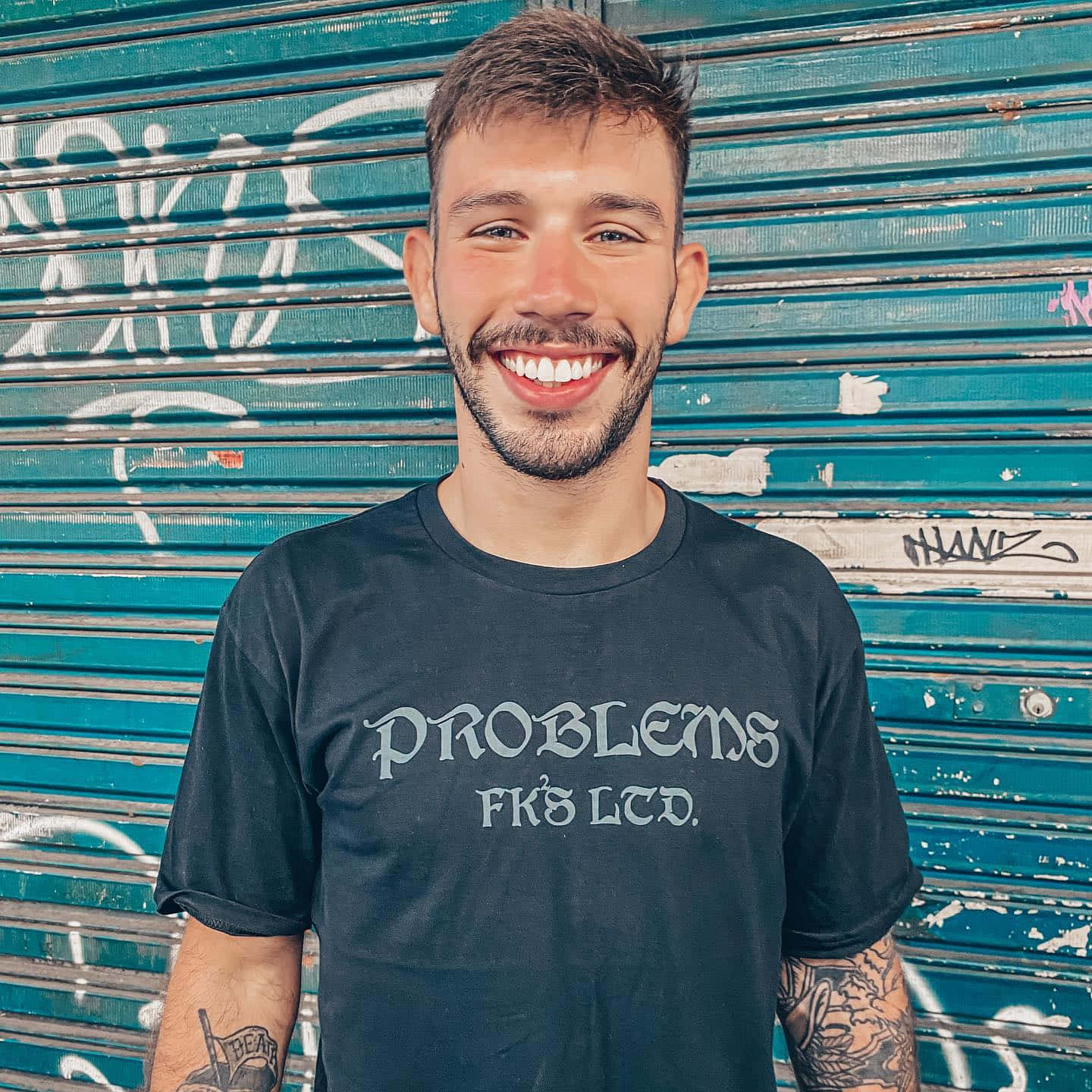 Matheus Nicolau Against Roll-up Door Background