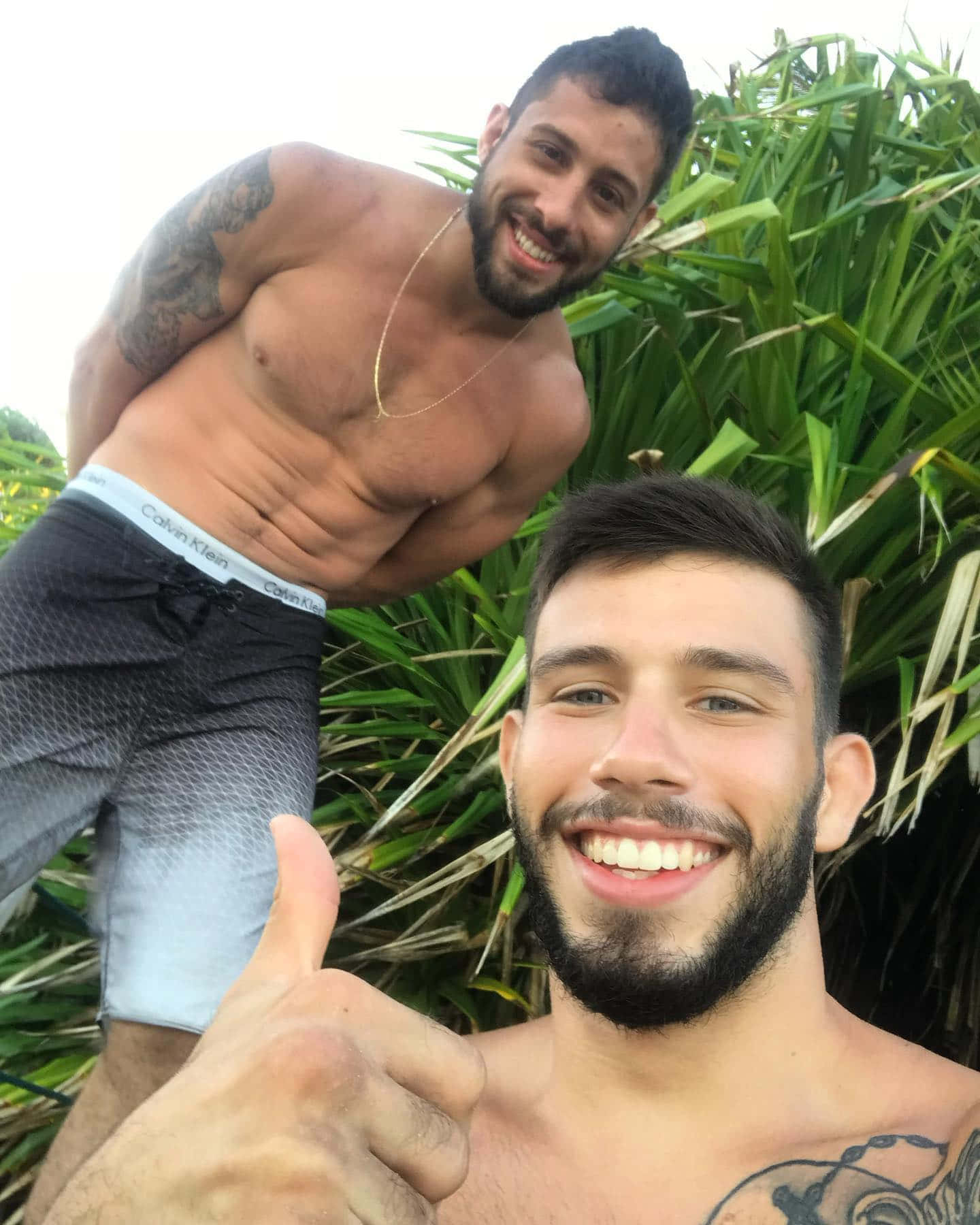 Matheus Nicolau And Friend In Grassy Background