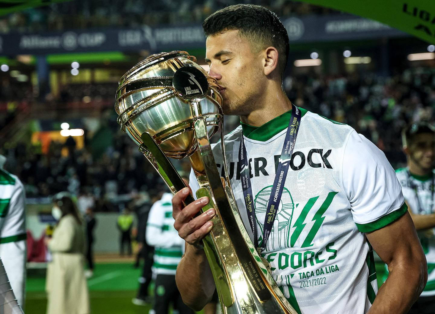 Matheus Nunes Kissing A Trophy Background