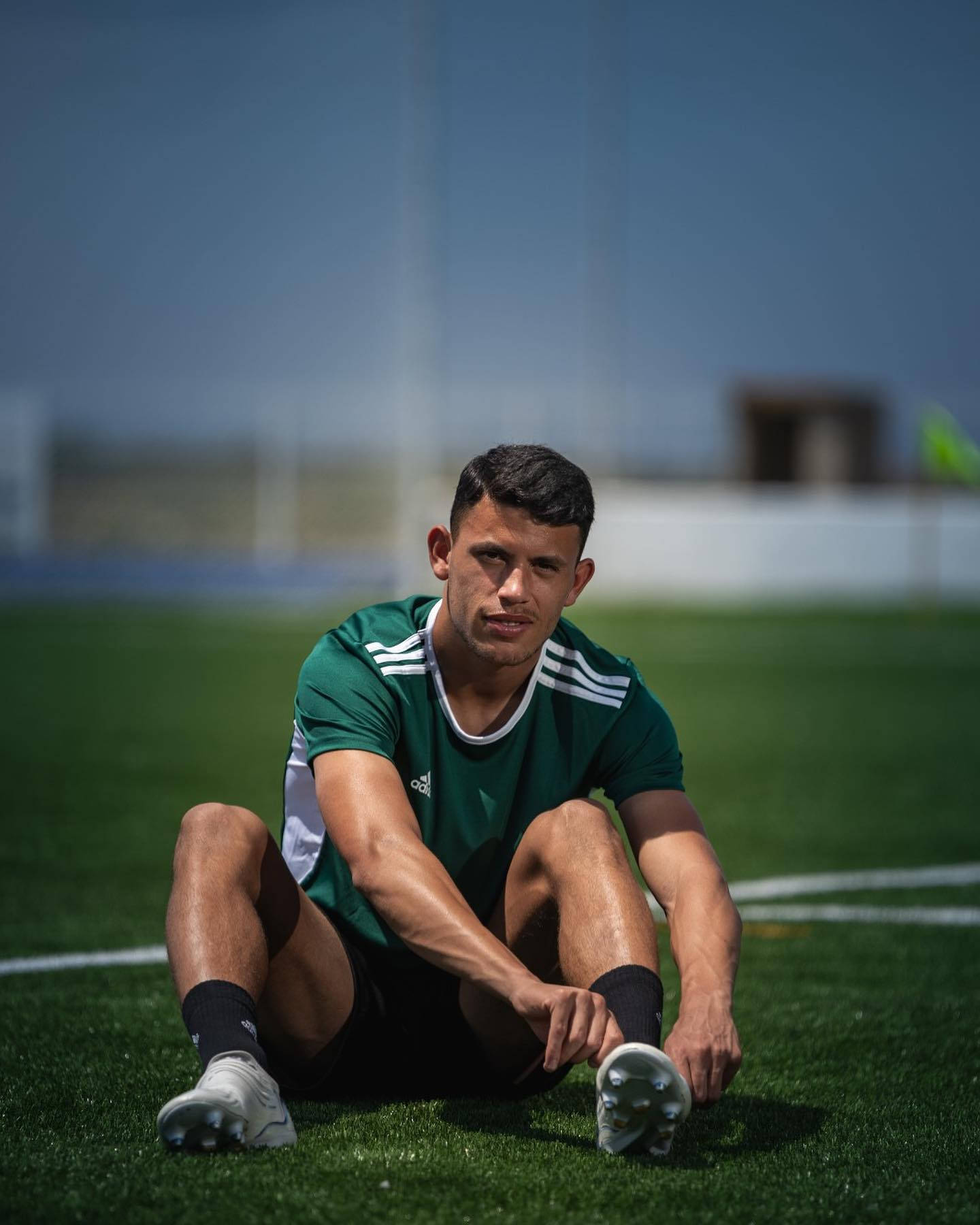 Matheus Nunes Sitting On The Field Background