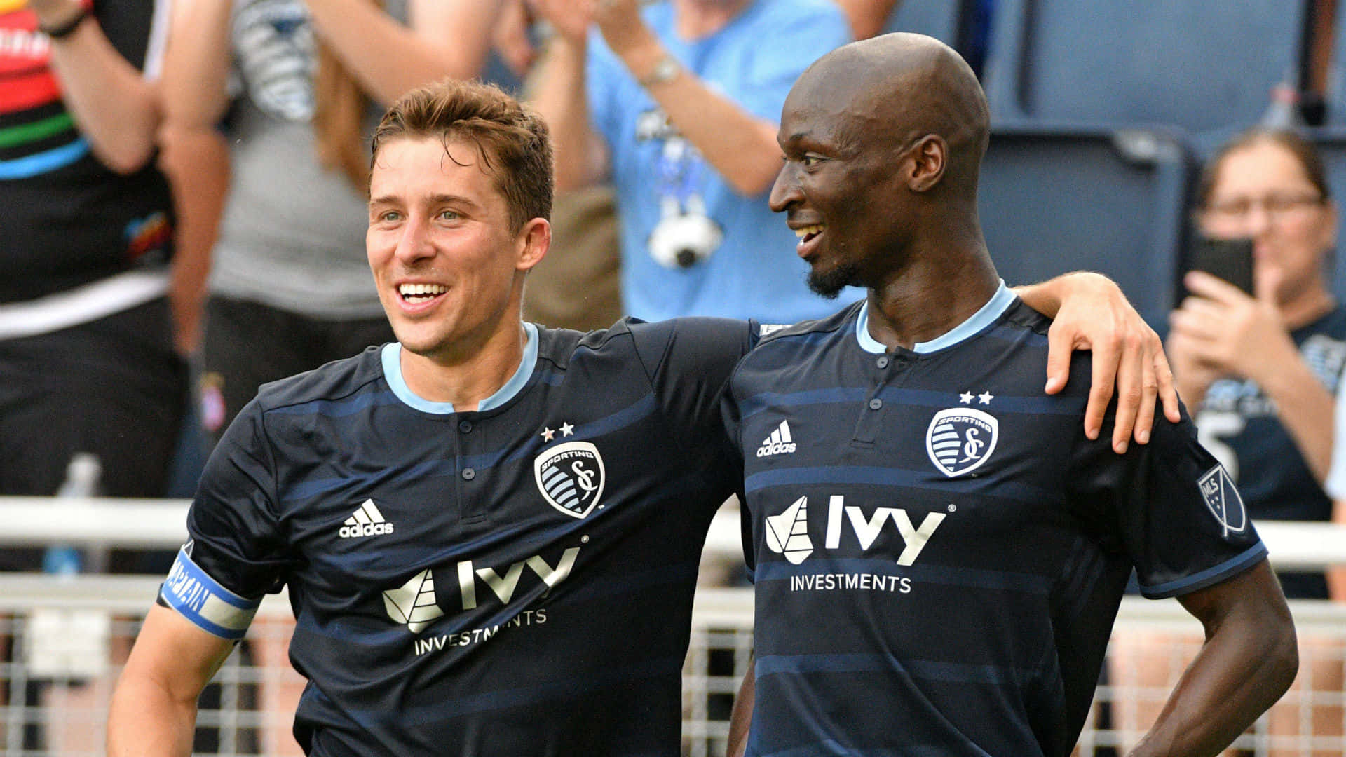 Matt Besler And Ike Opara Of Sporting Kansas City Background