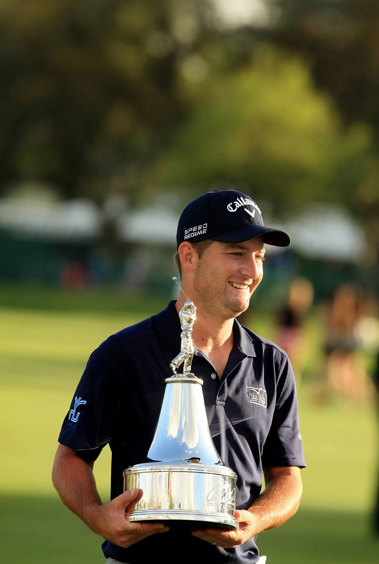 Matt Every Smiling While Holding Trophy Background