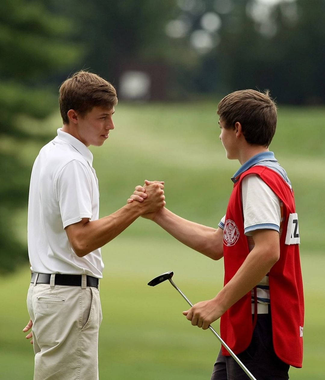 Matt Fitzpatrick Shaking Hands With Brother Background