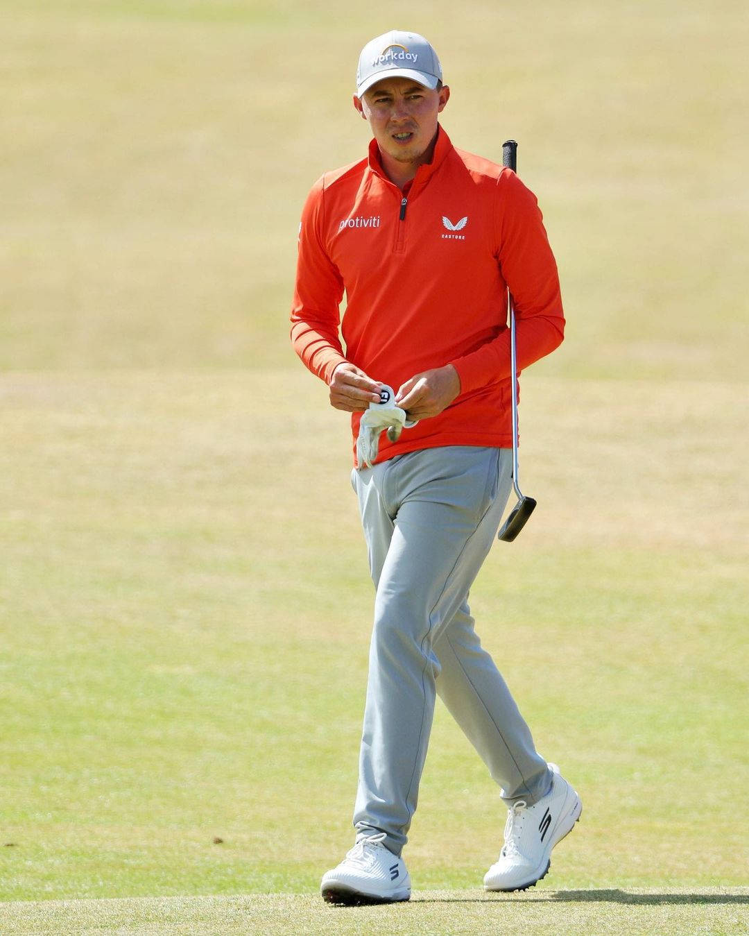 Matt Fitzpatrick Wearing Orange Golf Attire Background