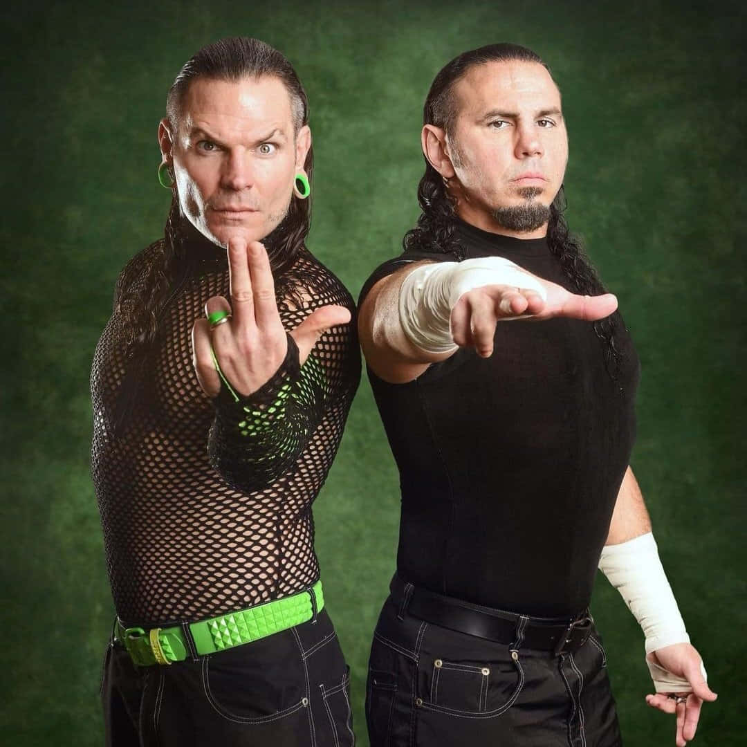 Matt Hardy And Jeff Hardy In Aew Wrestling Action Background