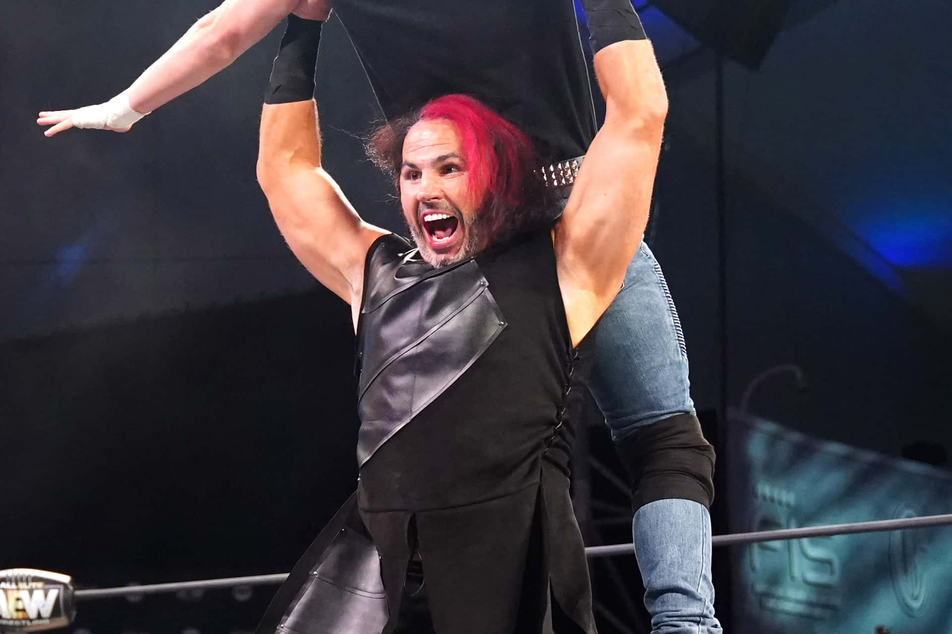 Matt Hardy In Aew Wrestling Attire Showcasing His Fiery Red Hair. Background