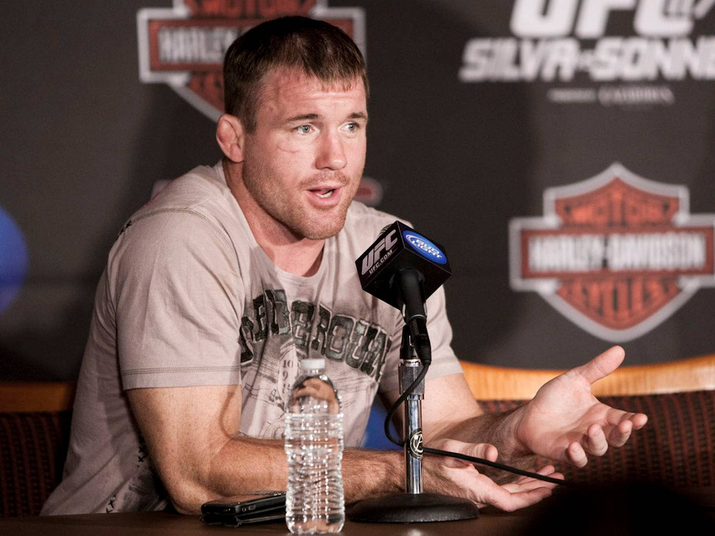 Matt Hughes Gesturing During Interview Background