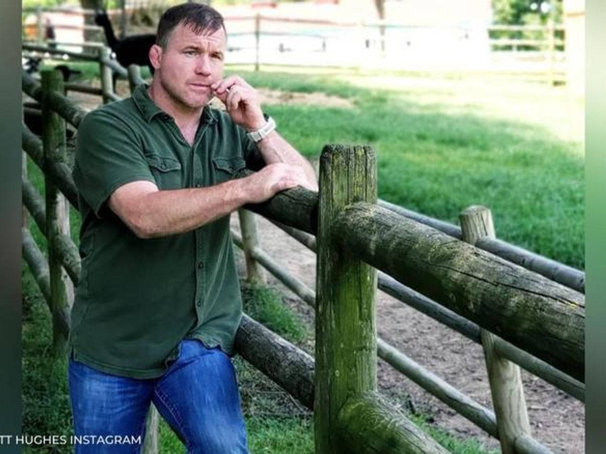 Matt Hughes Posing On Fence Background