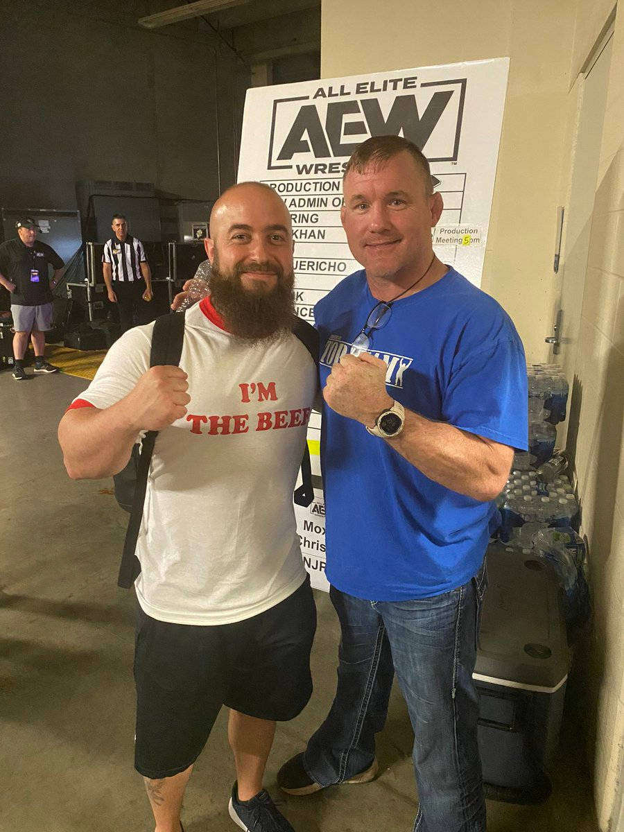 Matt Hughes Posing With Fan Background