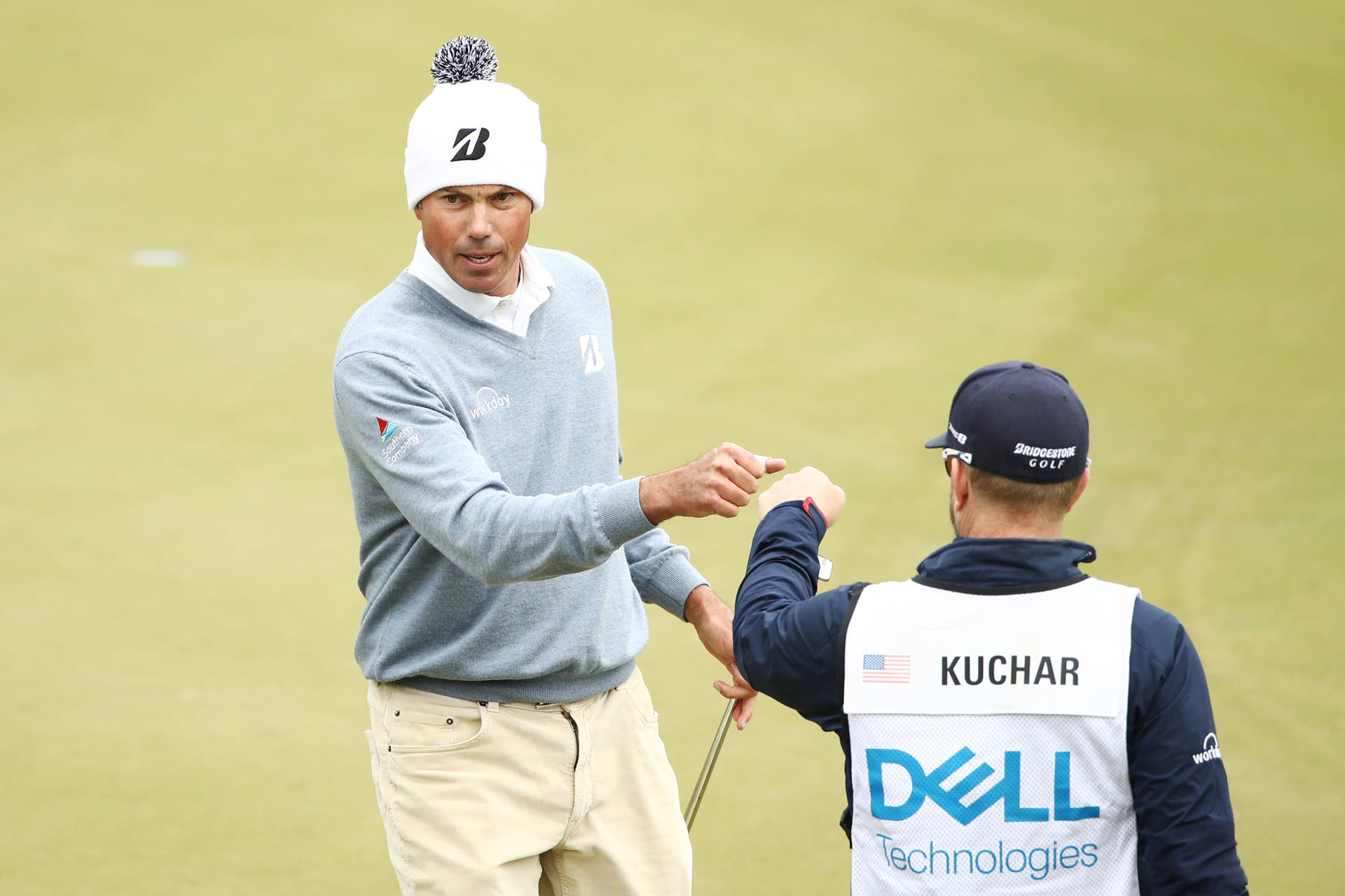 Matt Kuchar Giving Fist Bump Background