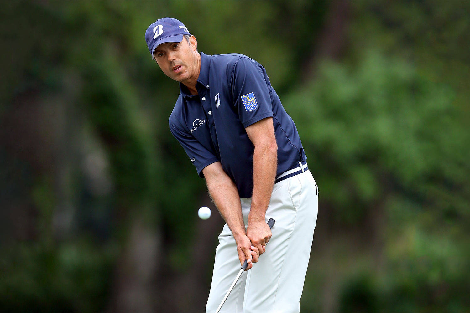 Matt Kuchar Hitting The Ball Background