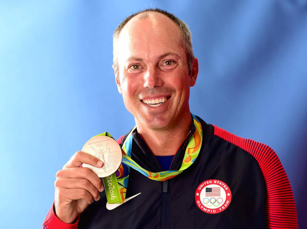 Matt Kuchar Holding Gold Medal Background