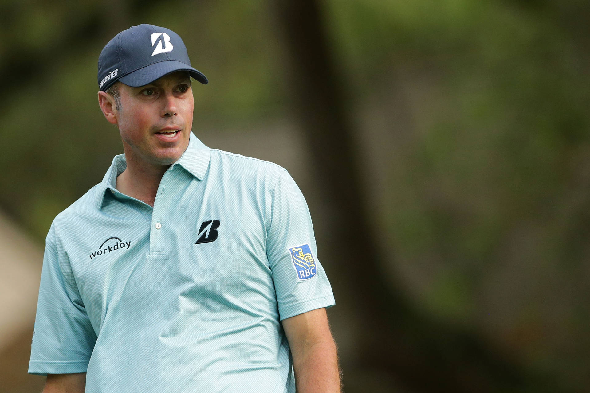 Matt Kuchar In Light Blue Shirt Background