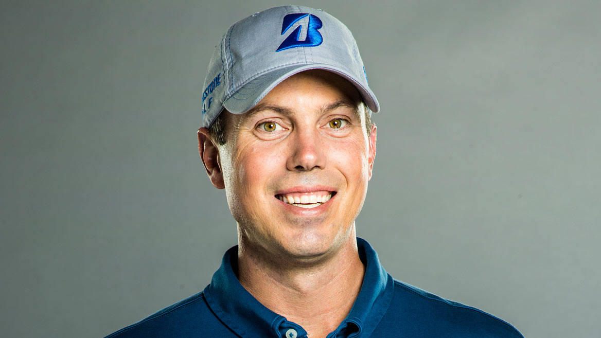 Matt Kuchar Power Swing On Golf Course Background