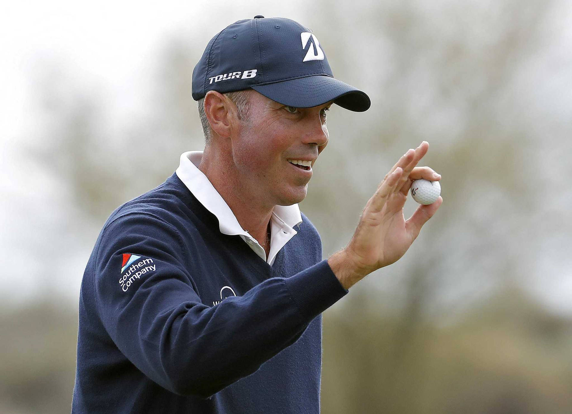 Matt Kuchar Showing Golf Ball Background