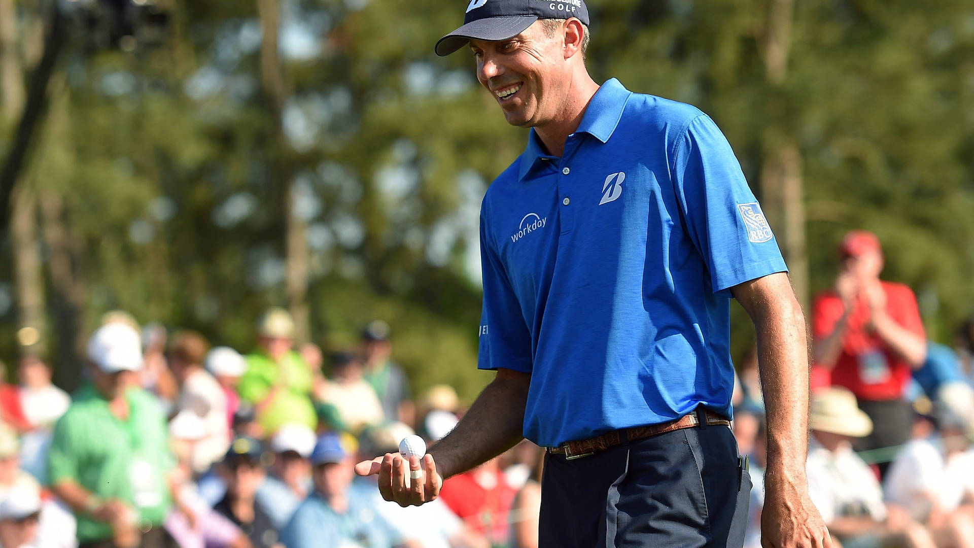 Matt Kuchar Smiling And Holding Ball Background