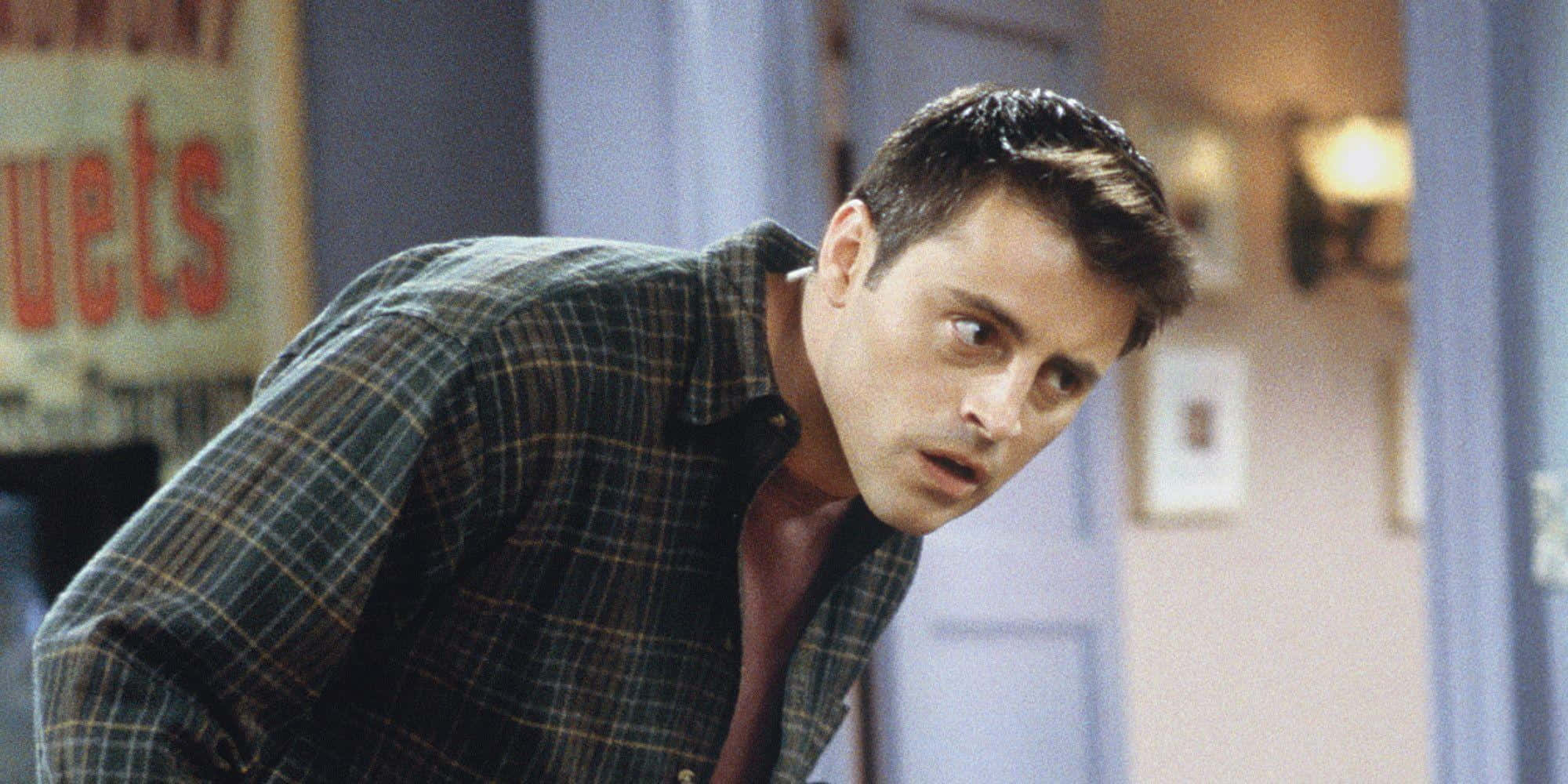 Matt Leblanc Wearing A T-shirt And Jacket And Smiling. Background