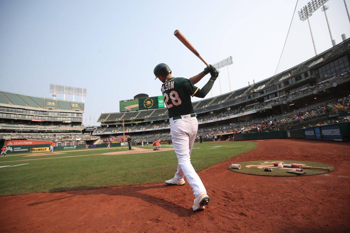 Matt Olson Swinging Bat From Stadium Background