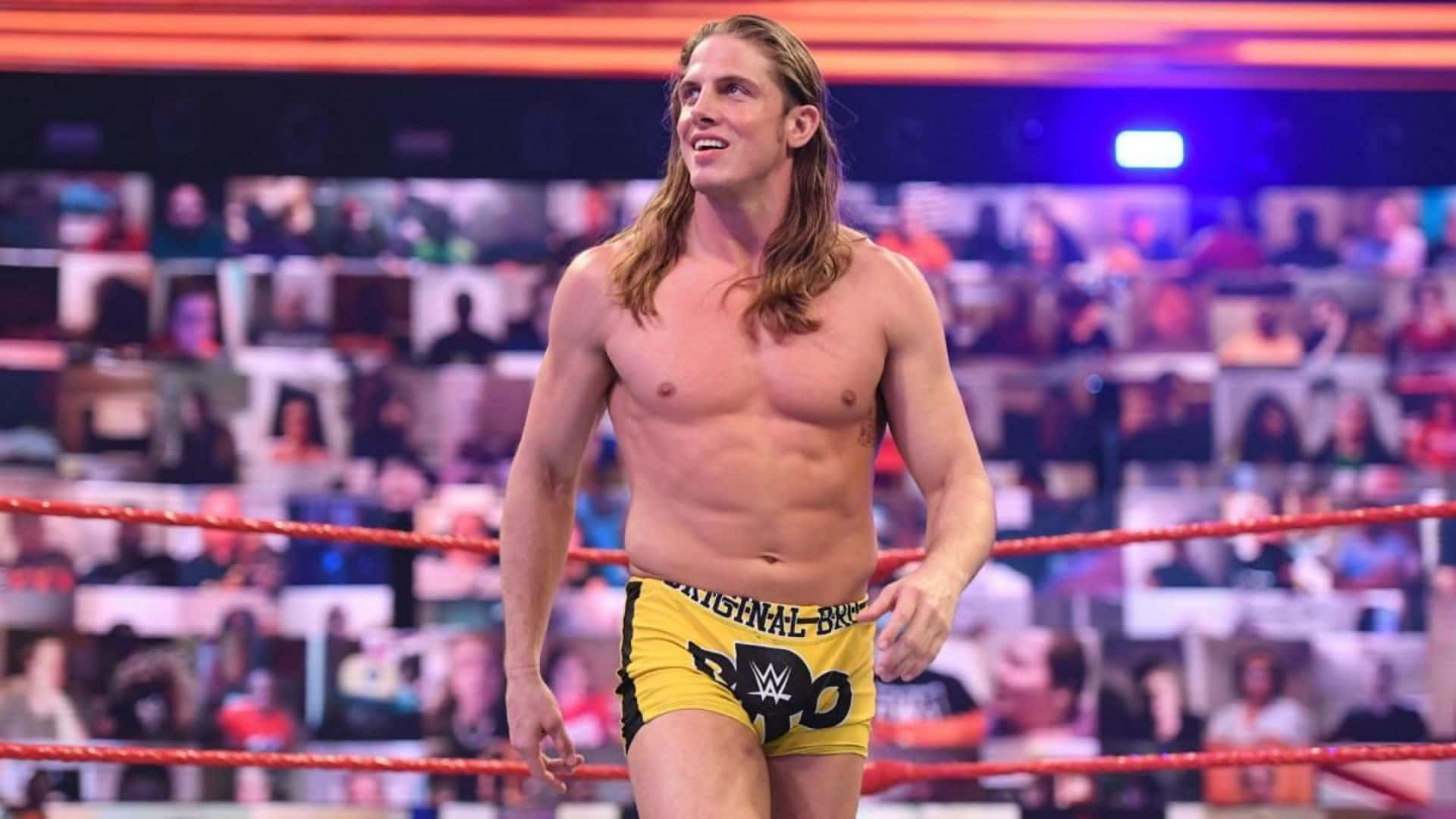 Matt Riddle Wearing Yellow Wrestling Shorts Background
