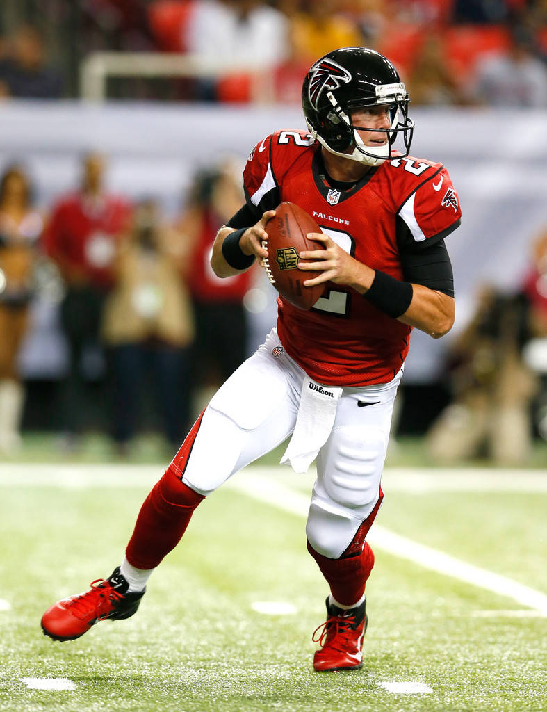 Matt Ryan Gripping A Ball Background