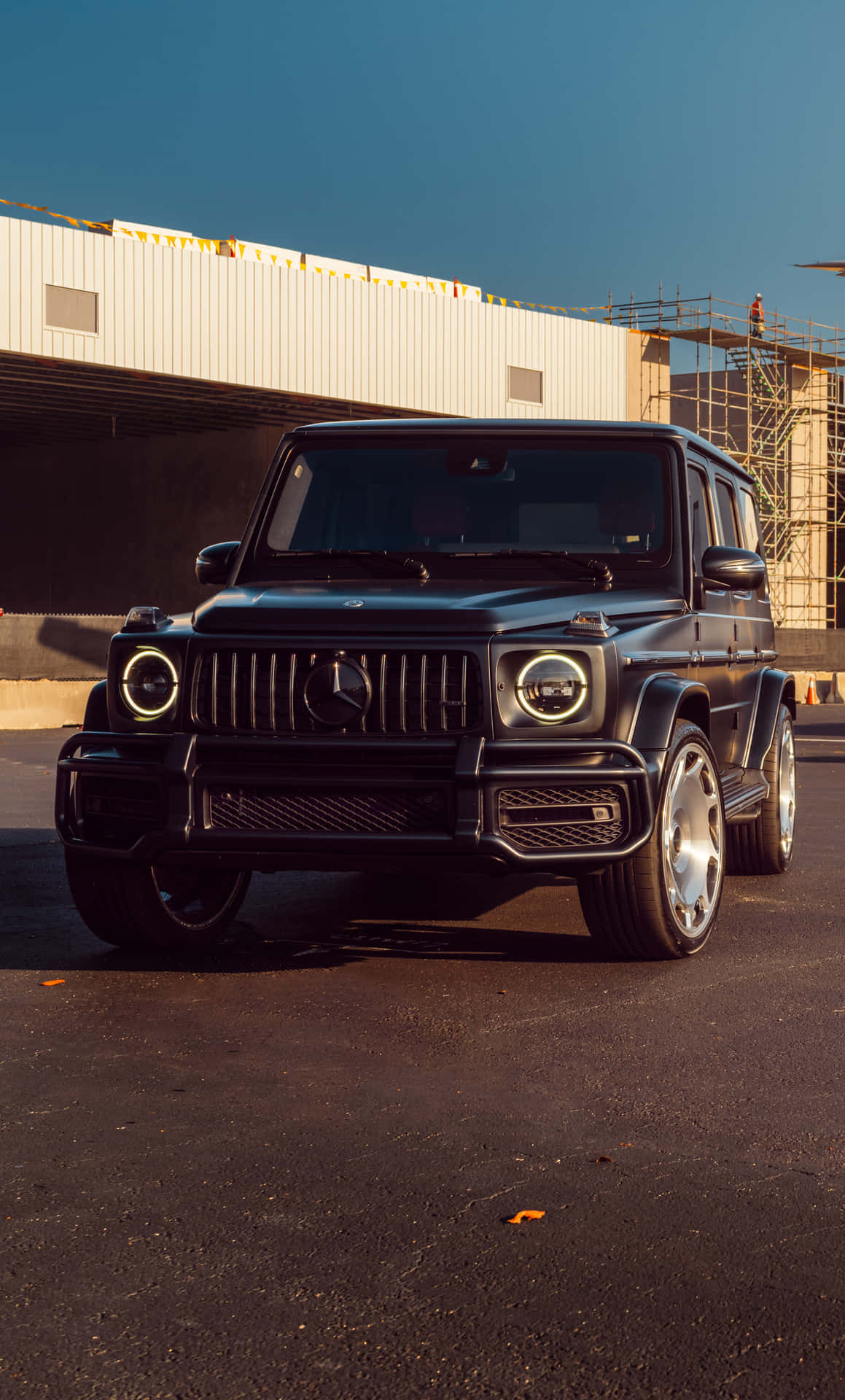 Matte Black Luxury S U V Parked Outdoors Background