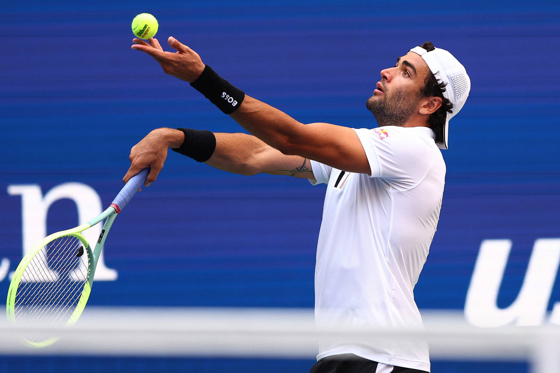 Matteo Berrettini In Action During A Tennis Game Background