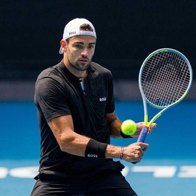 Matteo Berrettini In-action With Tennis Ball Background