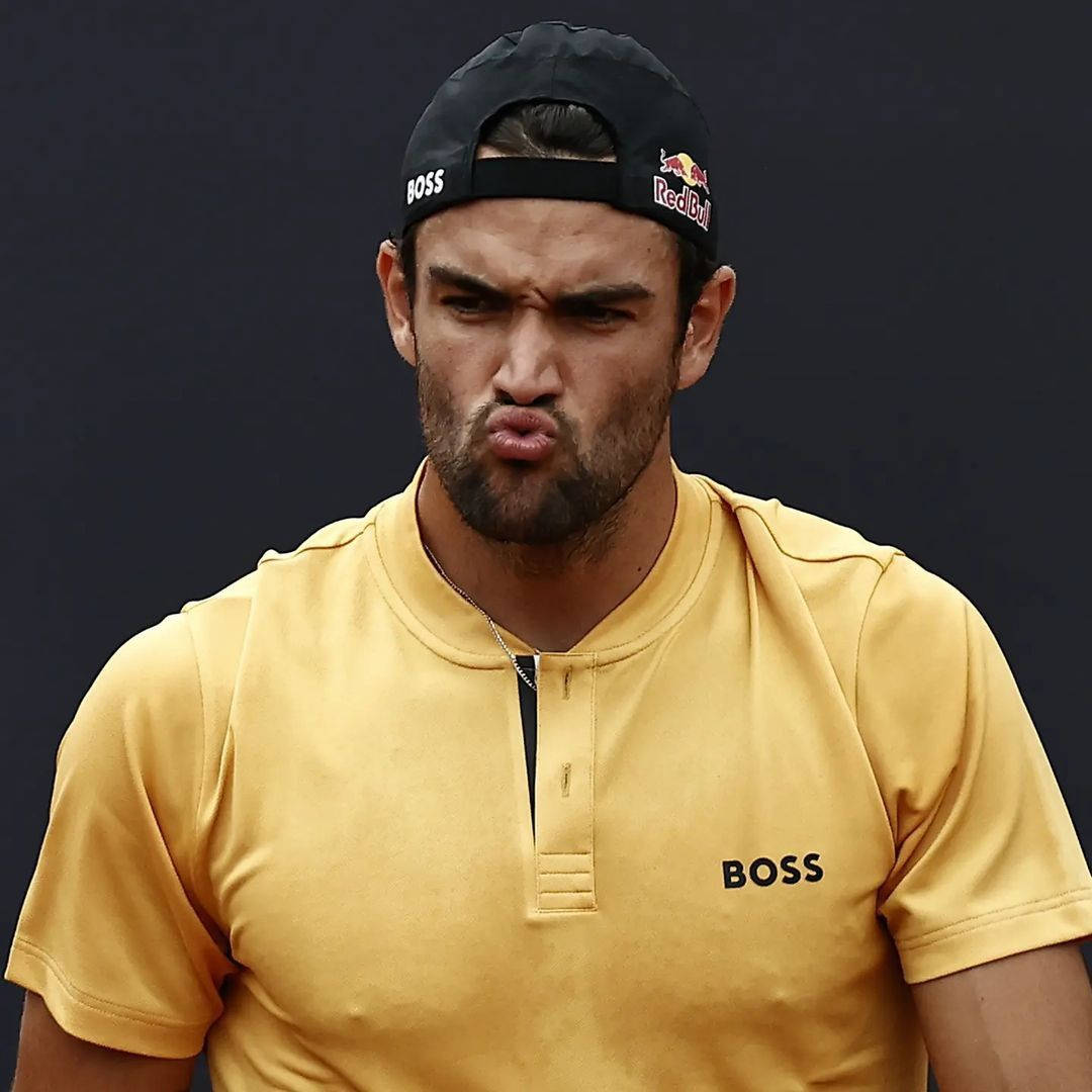 Matteo Berrettini In An Intense Moment On The Tennis Court Background