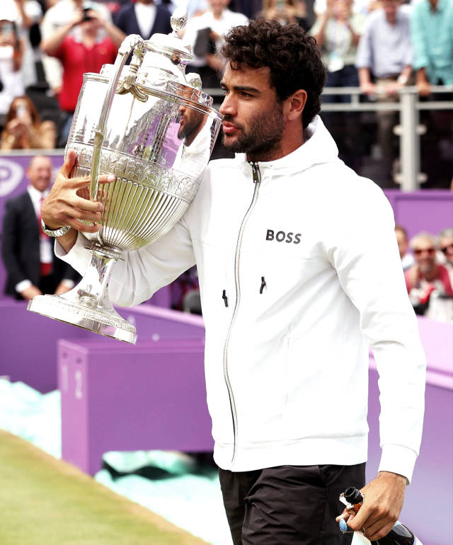 Matteo Berrettini Proudly Holding His Tennis Trophy Background