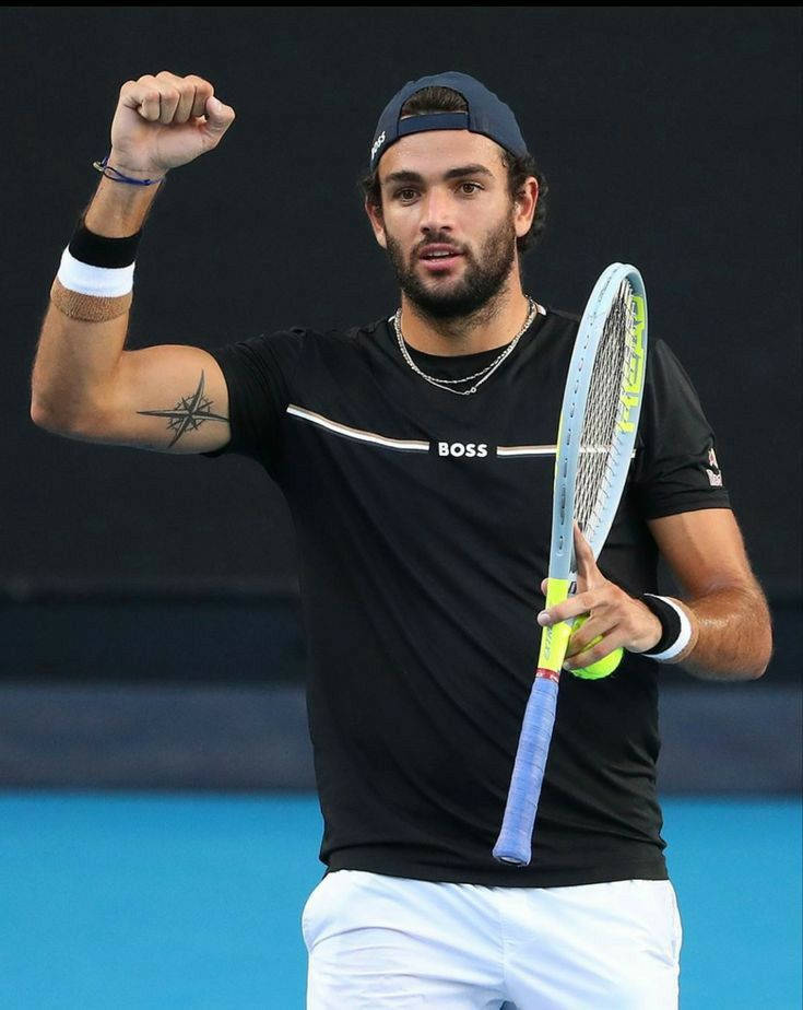 Matteo Berrettini Raising A Closed Fist Background