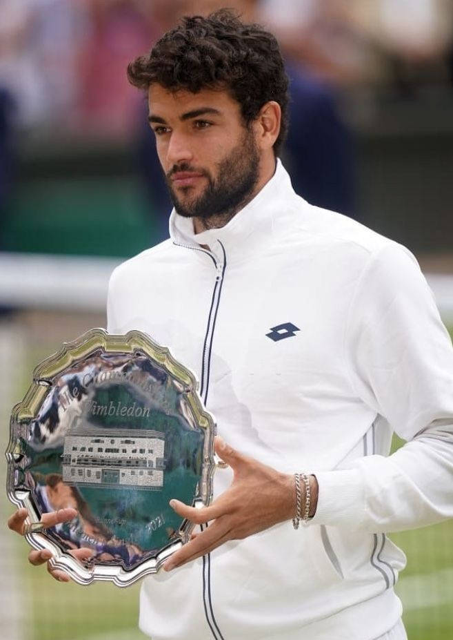 Matteo Berrettini With Wimbledon Trophy Background