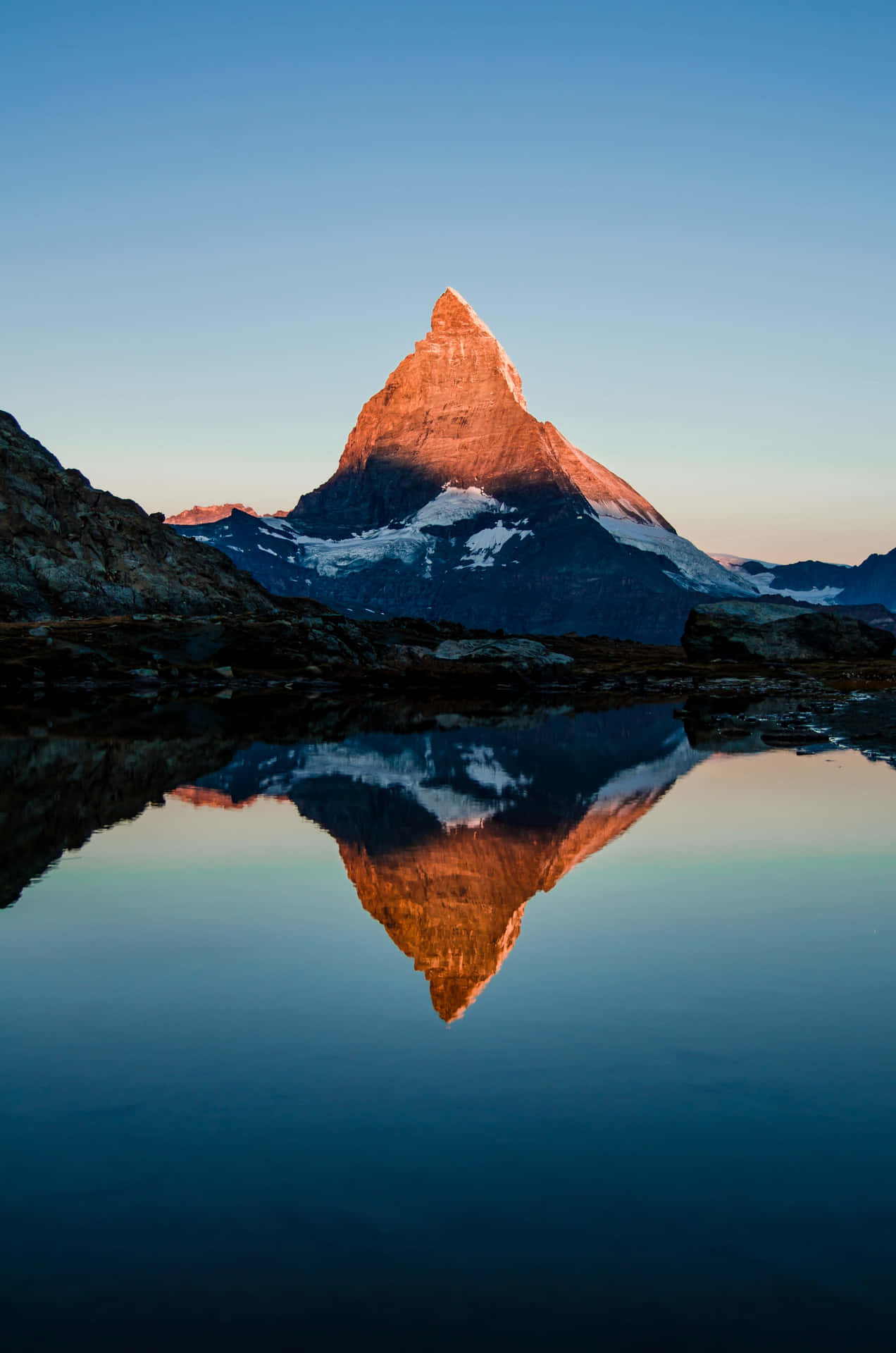 Matterhorn Reflected In A Lake Background