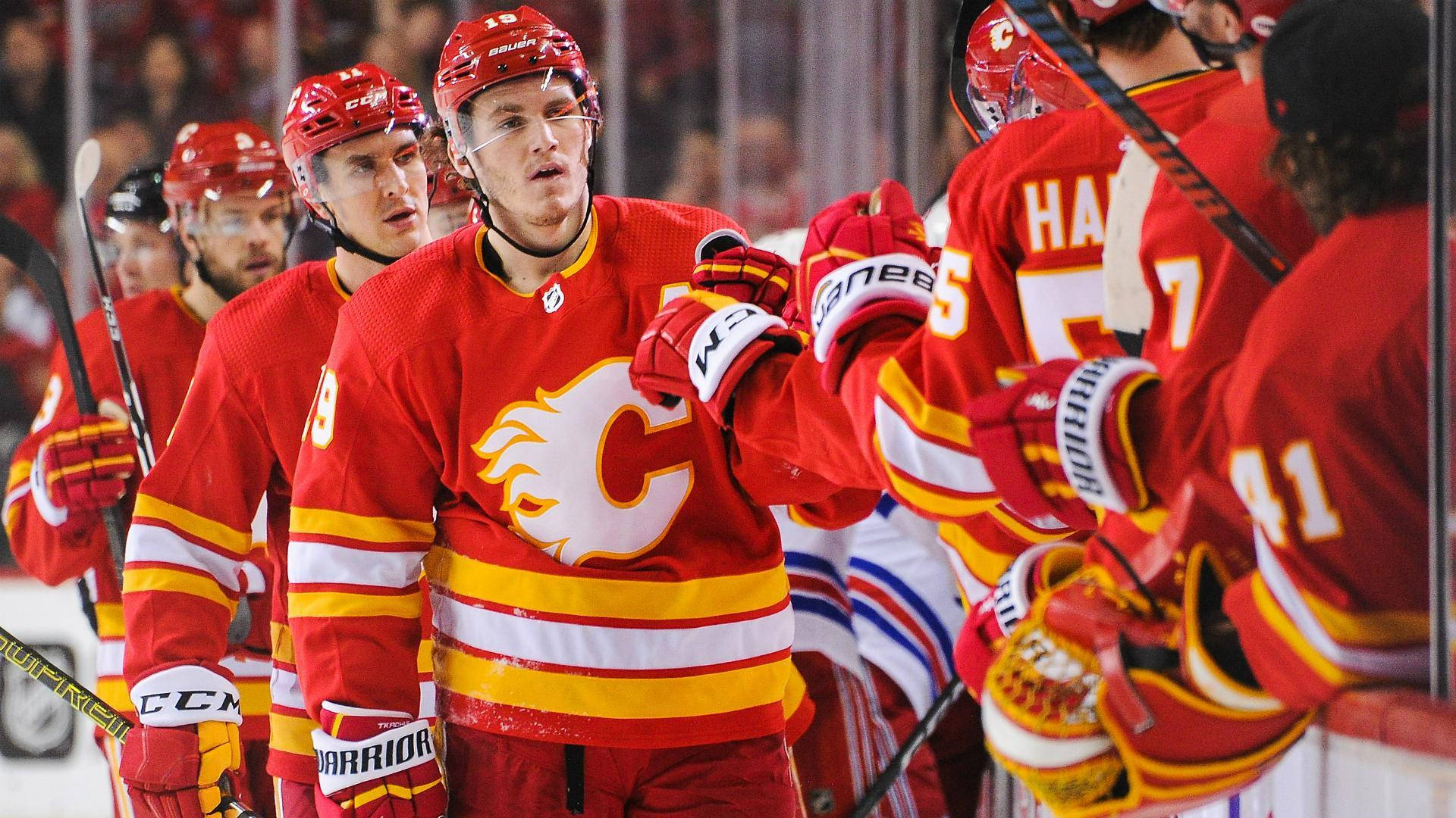 Matthew Tkachuk With Teammates Pre-game Fist Bump Background