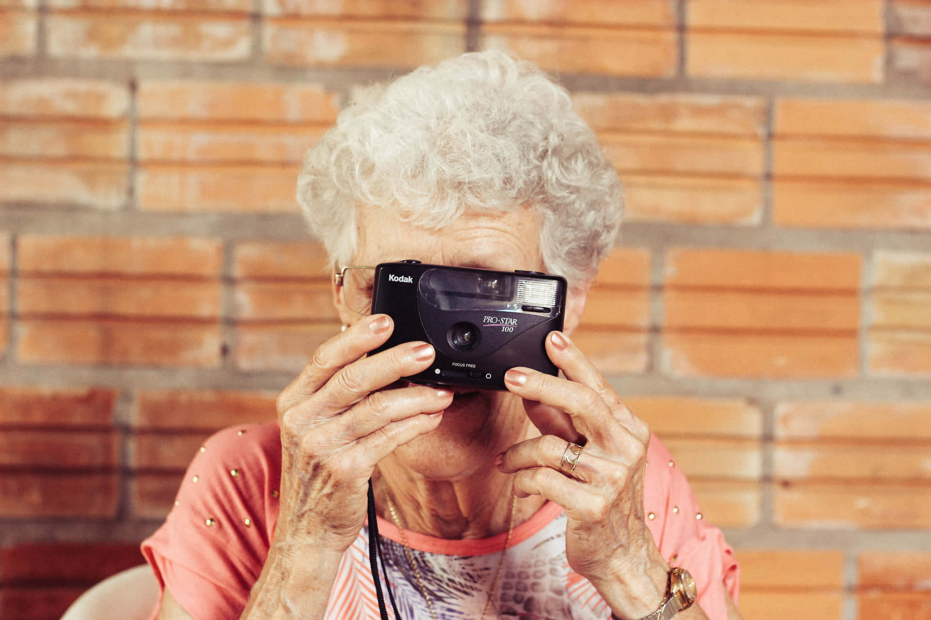 Mature Lady Shooting With Film Camera Background