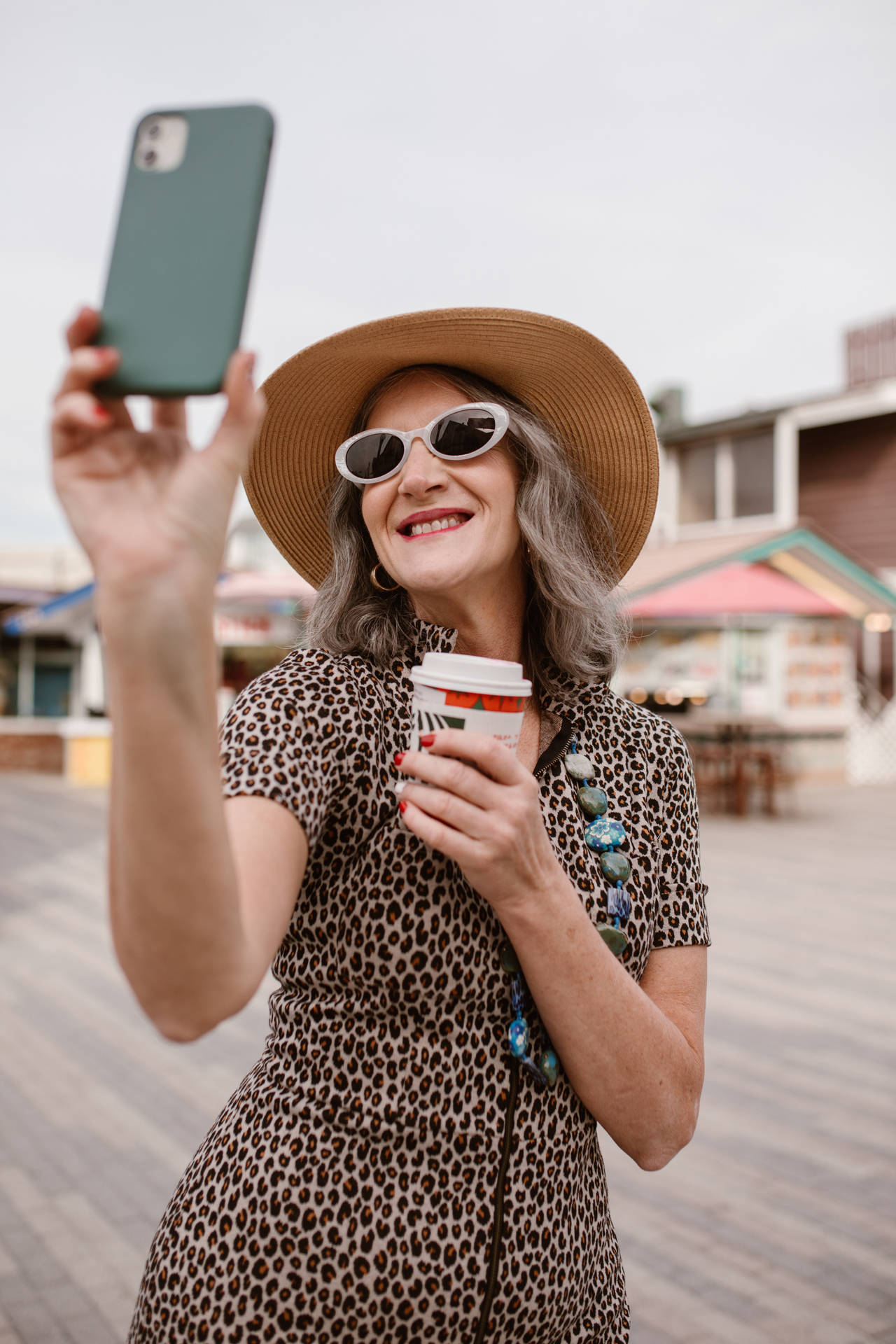 Mature Woman Embracing Adventure Background