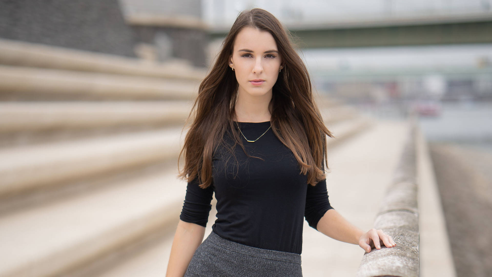 Mature Woman Posing On Large Stone Steps Background