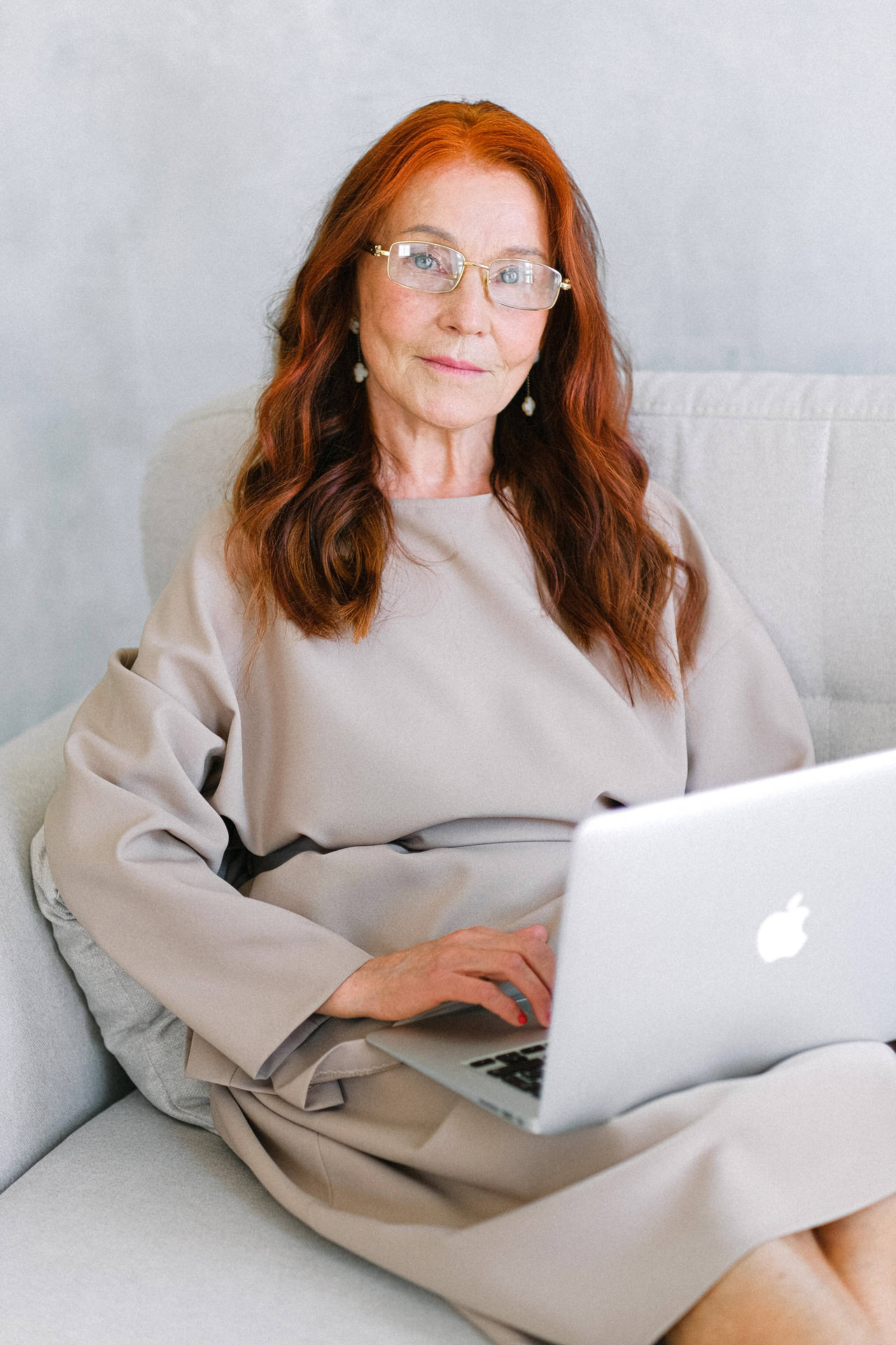 Mature Woman Working On Her Laptop Background