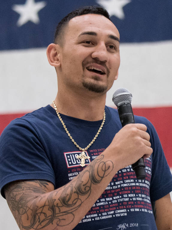 Max Holloway With Microphone Background