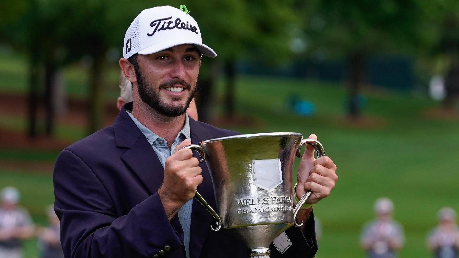 Max Homa In Suit Jacket Holding Trophy Background