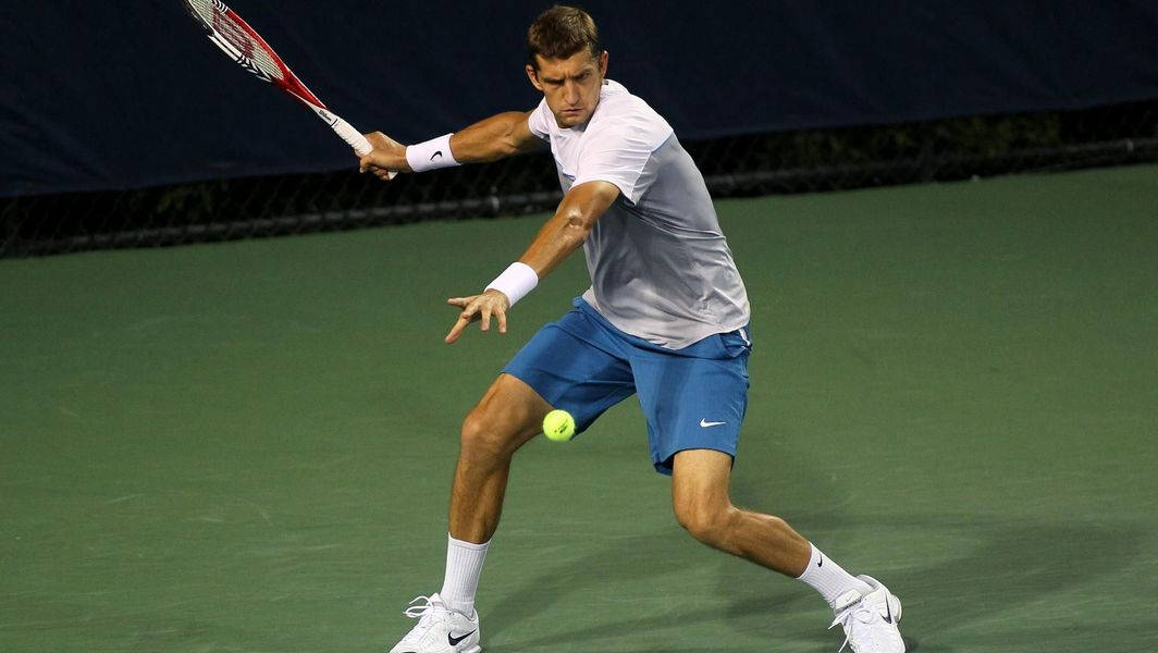 Max Mirnyi Intensely Focusing On Tennis Ball Background