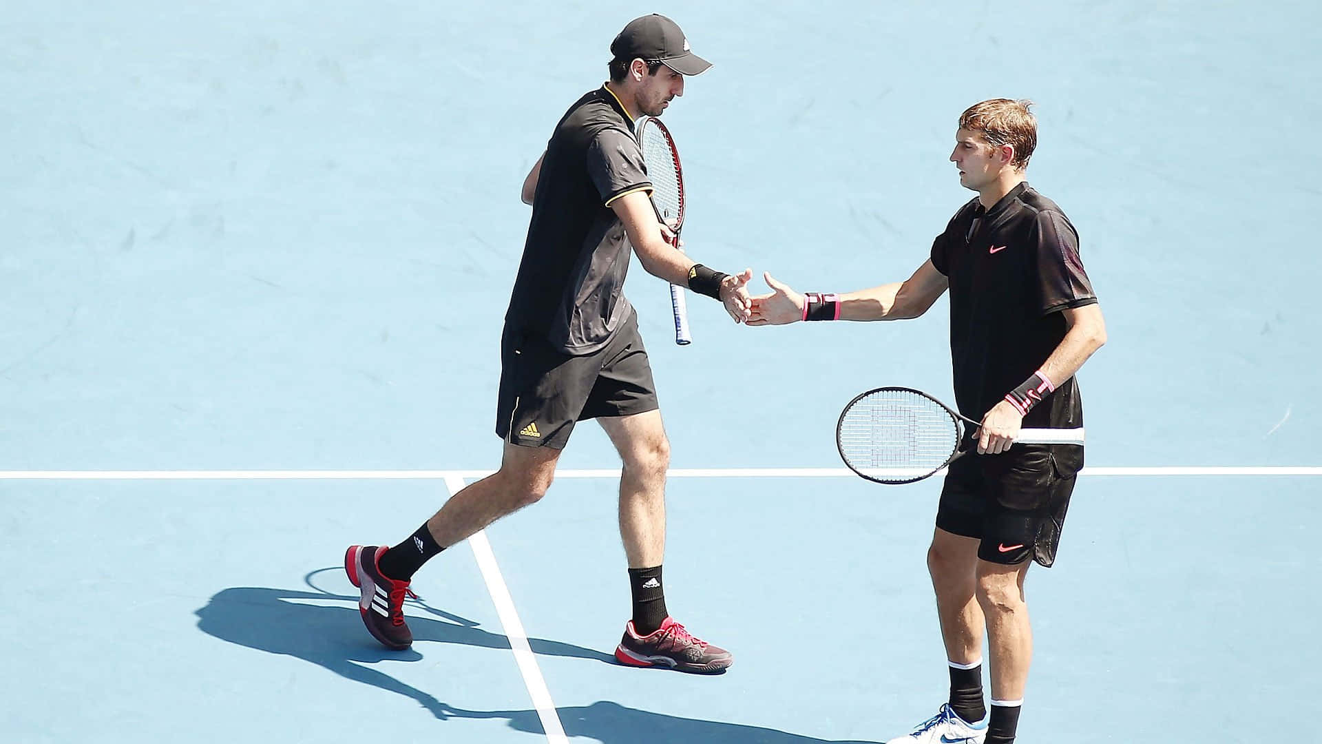 Max Mirnyi Shaking Hands With Partner Background